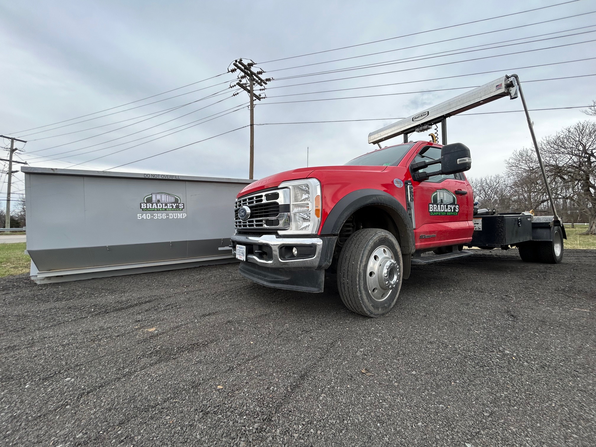 Bradley's Dumpster Service truck and roll-off dumpster in Waynesboro Virginia